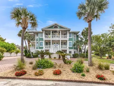 Three-story green beach home on Tybee Island